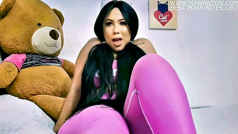 Lissa Tyler in pink leggings spreads legs teasingly with teddy bear