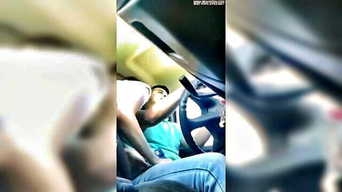 Blurry amateur clip of wife in teal top getting intimate in car with best friend while driving