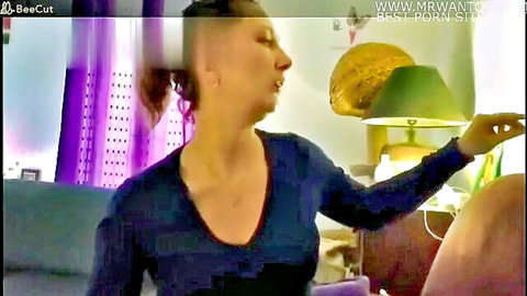 Amateur French woman with undercut hair in blue top giving blowjob