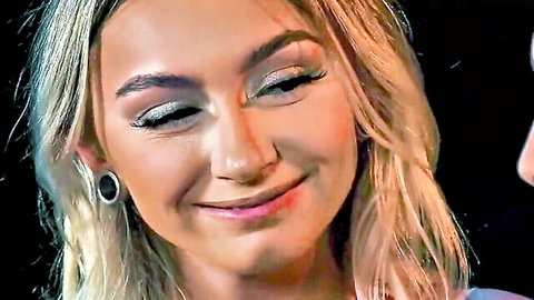Blonde teen Chloe Temple smiling seductively, close-up portrait