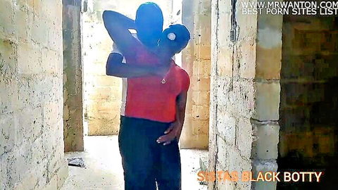 Black boss embraces employee intimately in unfinished building