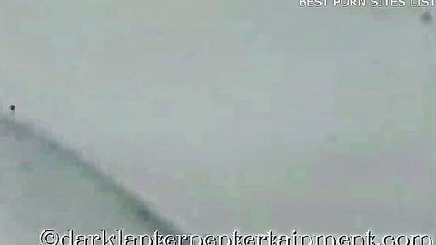 Blurry dark vintage porn thumbnail with heavy watermarks obscuring hairy pussy blowjob action