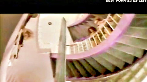 Seductive blondes posing on purple spiral staircase in Art of Desire
