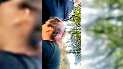 Blurry thumbnail of model Nik with pink hair in black top outdoors