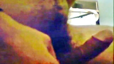 Close-up blowjob with hand gripping thick cock, intense oral action