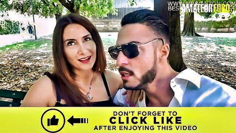Petite Italian brunette smiles with handsome bearded stud on park bench selfie tease