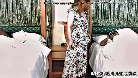 Violette Blakk in floral dress with Don Prince and Majiik Montana in bed