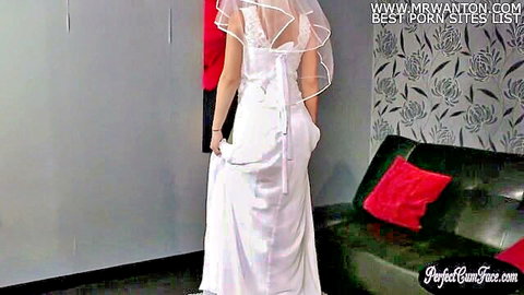 Busty UK bride in white wedding dress, veil, back view