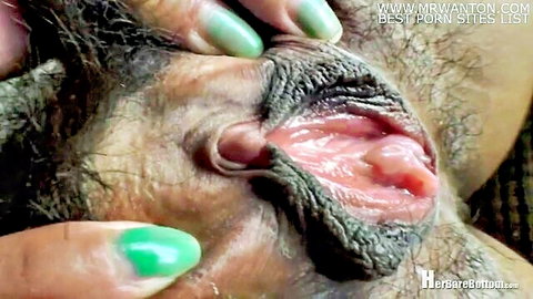 Qi Bush's hairy pussy close-up spread by green-nailed hands