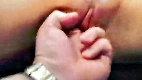 Man's fingers roughly spreading open shaved pink pussy lips closeup