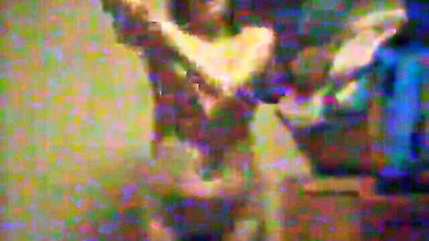 Busty nude babe raises arms exposing massive tits in blurry taboo scene