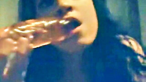 Brunette amateur sucking thick realistic dildo with saliva dripping from her lips