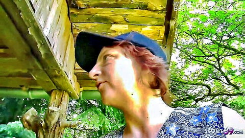 German mature swinger in cap and top at beach for FFM threesome