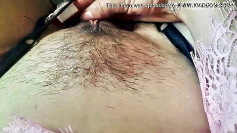 Close-up of sweet hairy pussy tenderly spread and played with
