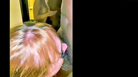Chloe Sparkles blonde giving intense blowjob to muscular man in bathroom mirror view