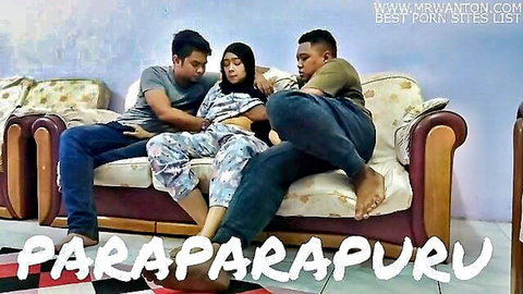 Zana in tudung enjoys threesome tease with two men on couch