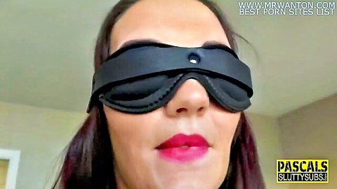 Blindfolded submissive brunette with red lips in Kink fetish scene
