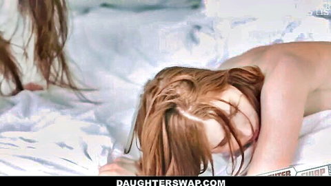 Two nude redhead and brunette teens lying on bed in daughter swap scene