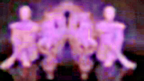 Blurry purple-toned abstract figures in suggestive adult scene