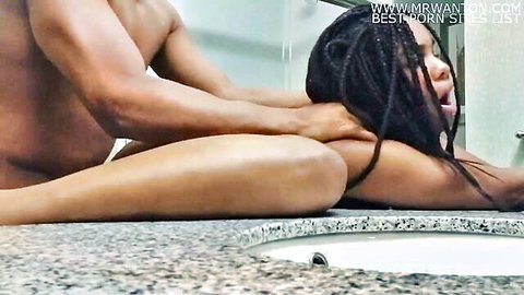 Muscular black stud roughly chokes ebony babe's neck while fucking her prone bone on bathroom floor