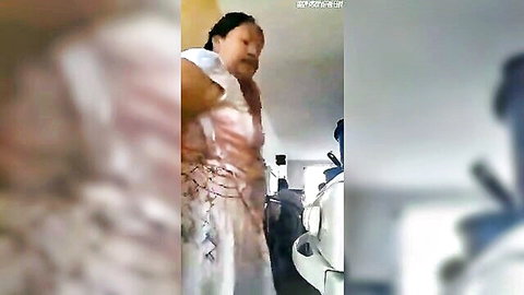 Mature Latina granny in sheer white lace dress standing by white car