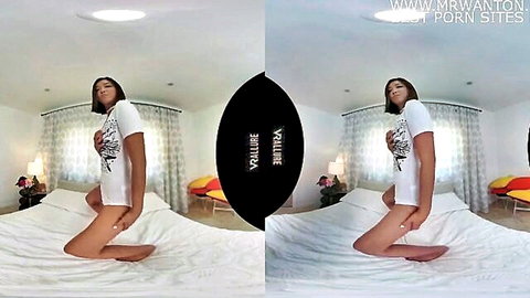 Slim Asian woman in tight white t-shirt posing seductively on bed in VR