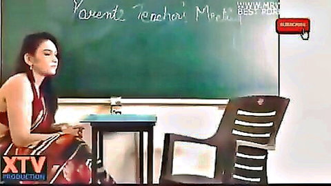 Indian school teacher in red saree at parent-teacher meet