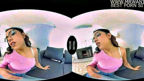 Petite Latina with glasses in pink top seductively teasing on couch in VR