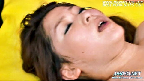 Japanese brunette moaning ecstatically with eyes closed and mouth wide open in pleasure