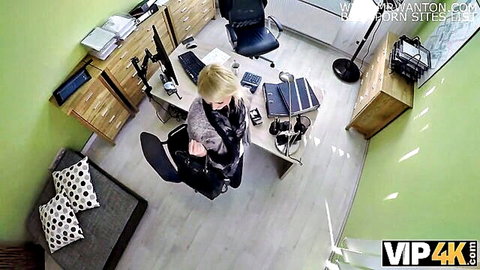 Blonde babe spreading legs on office desk in gray coat teasing