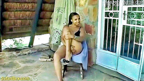 Busty African teen in seductive outdoor pose, short dress and heels