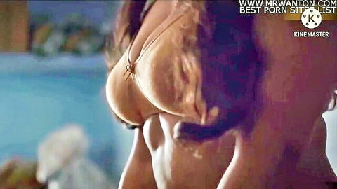 Desi woman in sheer lingerie showing deep cleavage, teasing bust