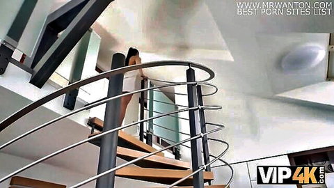 Roxanne Roselle in short white dress, teasing on staircase