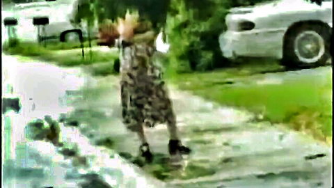 Latina amateur Monica in leopard dress walking outdoors, throwback style