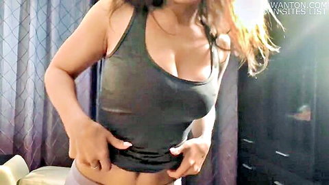 Russian model Lolly Lips teasing in gray tank top with deep cleavage