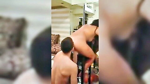 Nude man fucking woman doggystyle bent over stripper pole in bedroom