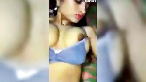 Sexy Indian babe pulls down blue bra exposing huge tits and nipple
