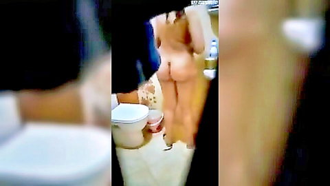 Olive-skinned Arab woman with big ass naked bending over toilet in bathroom