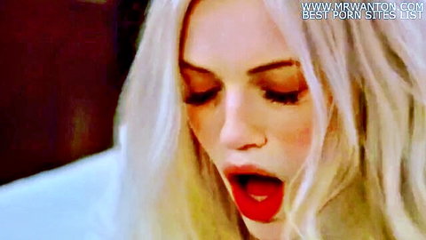 Blonde woman with ecstatic open mouth expression closeup