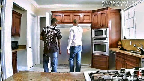 Two muscular black men standing by open fridge in modern kitchen ready for gangbang
