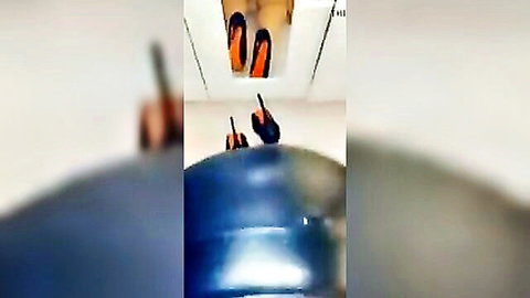 Big ass babe in orange heels bending over blue ball, teasing view
