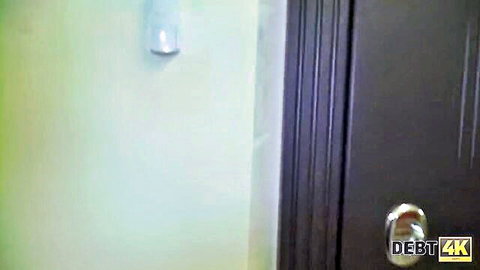 Empty bathroom door and green wall in DEBT4K adult video preview