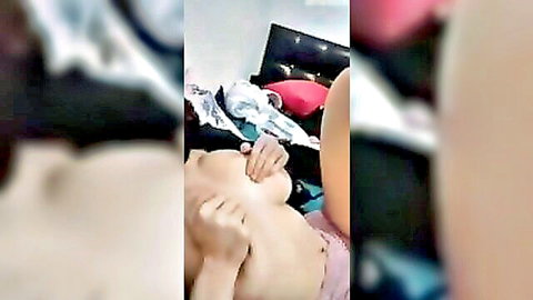 Turkish girl with big tits exposing breasts in pink lingerie solo