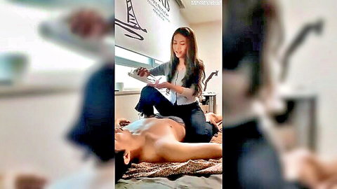 Korean masseuse straddles nude man's bare ass giving erotic back massage