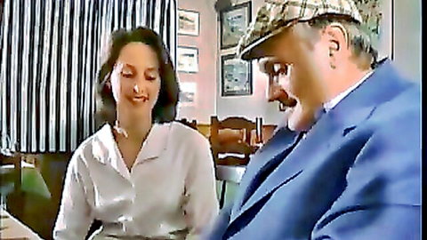 Hot brunette smiling at older suited man