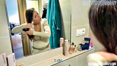 Czech brunette in bathroom brushing hair in mirror, wife swap scene