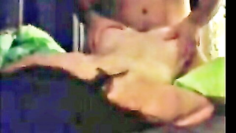 Nude Caucasian couple in close-up intimate embrace on bed