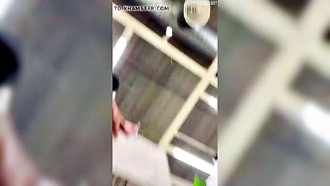 Woman in white dress bent over exposing ass in warehouse