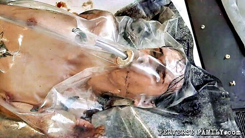Nude Asian woman trapped in tight vacuum bed plastic wrap, helpless bondage fetish