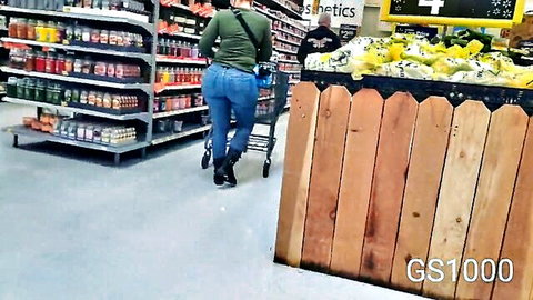 Ebony woman with perfect big ass in tight jeans walking in store